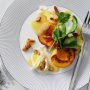 Peach salad with Burrata, almonds and speck