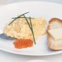 Perfect scrambled eggs with salmon pearls