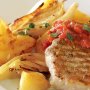 Pork cutlets with roasted potatoes, fennel & capsicum sauce