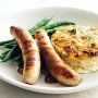 Pork sausages with cabbage and gruyere gratin