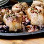 Pot-roasted poussin with pinot, garlic and grapes