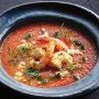 Roast tomato soup with prawns & basil oil