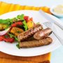 Skinless sausages with roasted vegetable salad