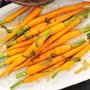 Honey-glazed baby carrots with mint