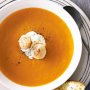 Maine pumpkin soup with sauteed scallops and ginger cream